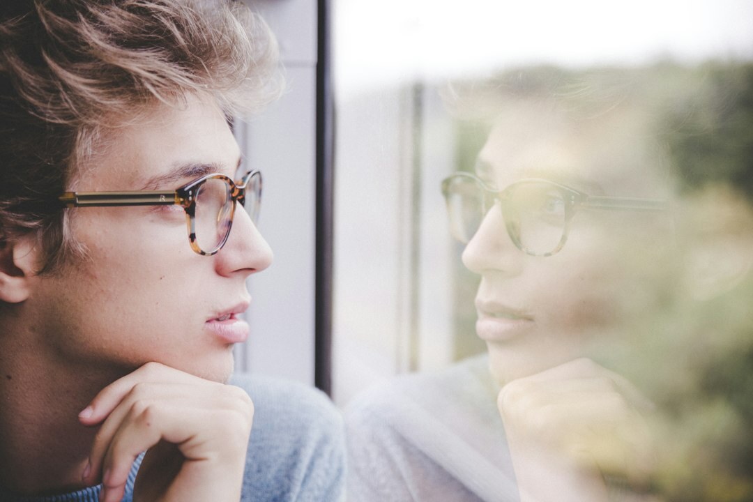 woman thinking by window